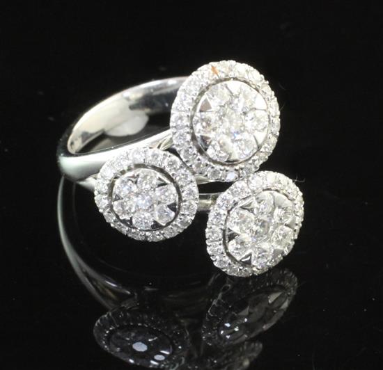 A modern Italian 18ct white gold and diamond triple cluster ring, size N.